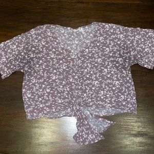 Short sleeve shirt, cropped fit. Brand is LUQ, size L